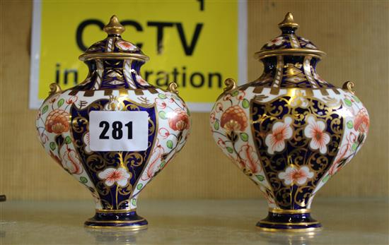 Pair of Derby Imari pattern lidded vases